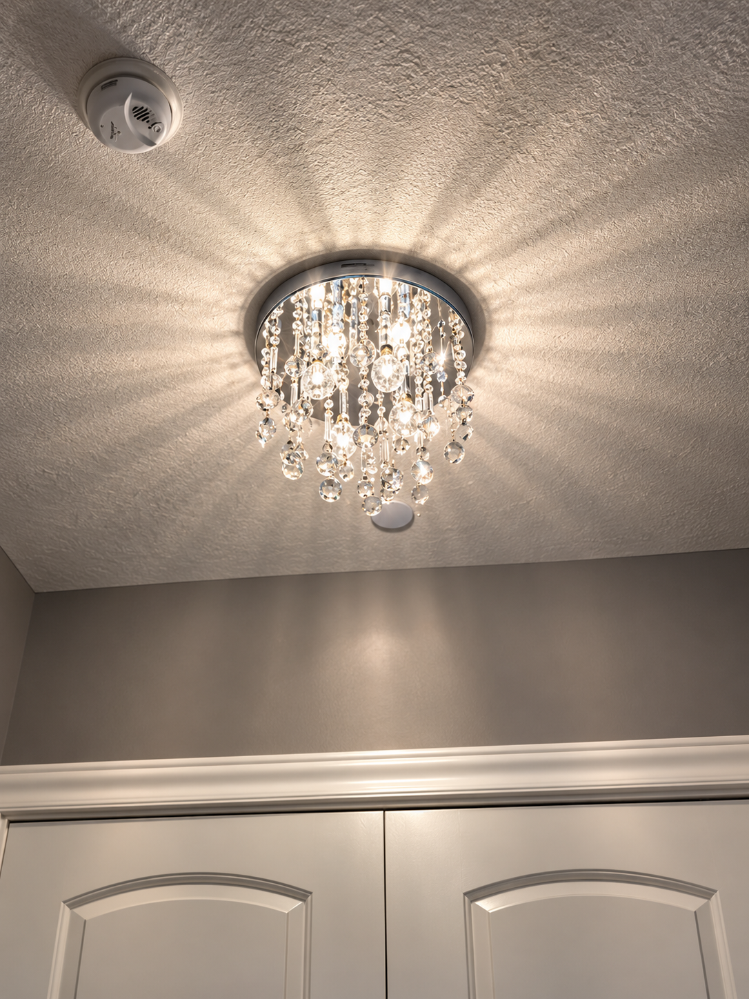 Crystal flush-mount chandelier installed by BrightNight